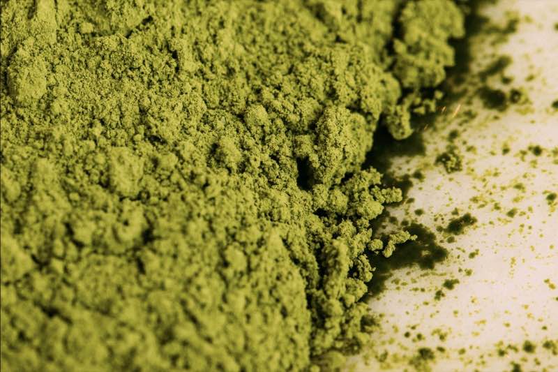 A close view of fine, bright green matcha powder